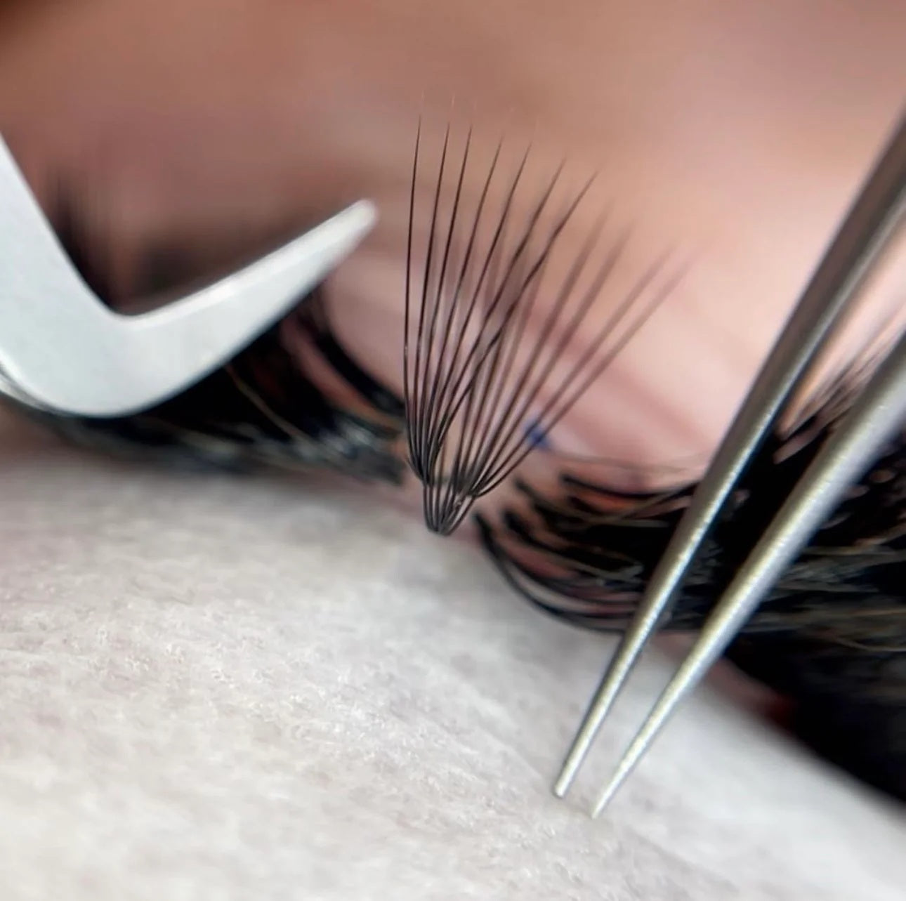 Why do lash extensions fall out faster at the outer corners of the eyes?